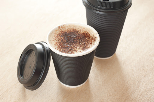 Freshly brewed hot coffee take away in a portable cup